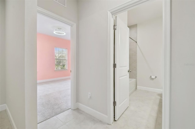 bathroom with visible vents, baseboards, tile patterned flooring, and shower / bathtub combination