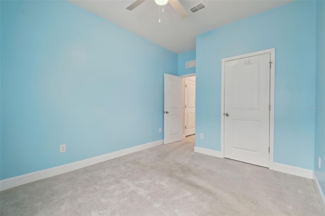 unfurnished bedroom with carpet floors, visible vents, ceiling fan, and baseboards