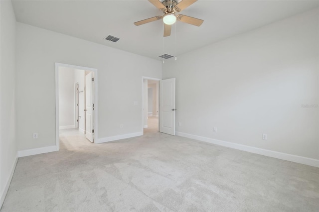 unfurnished bedroom featuring visible vents, ceiling fan, light carpet, and baseboards