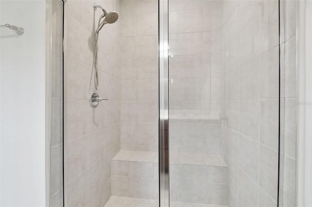 full bath with a shower stall