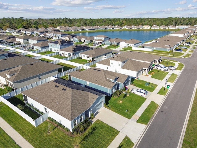 birds eye view of property featuring a residential view and a water view