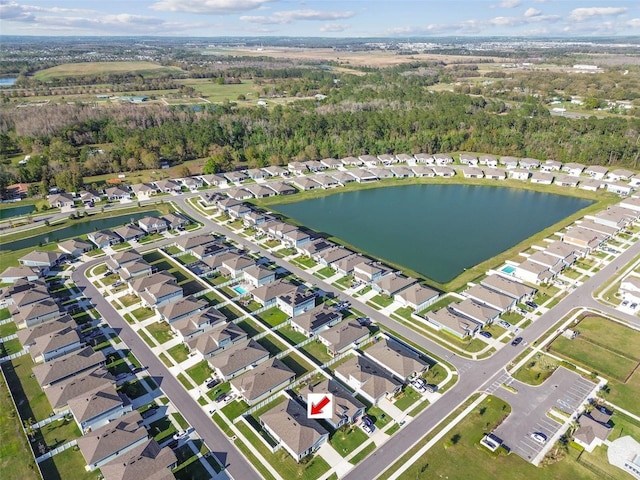 bird's eye view featuring a water view and a residential view