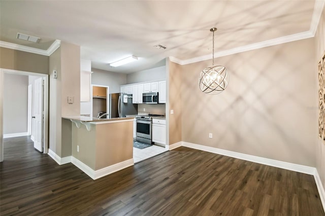 kitchen featuring stainless steel appliances, a peninsula, visible vents, and white cabinetry