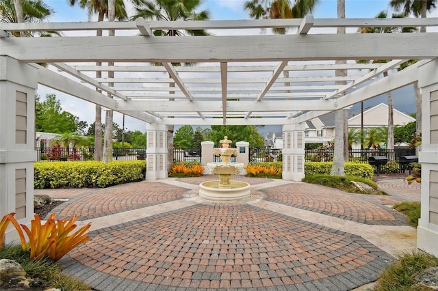 view of patio / terrace featuring a grill, fence, and a pergola