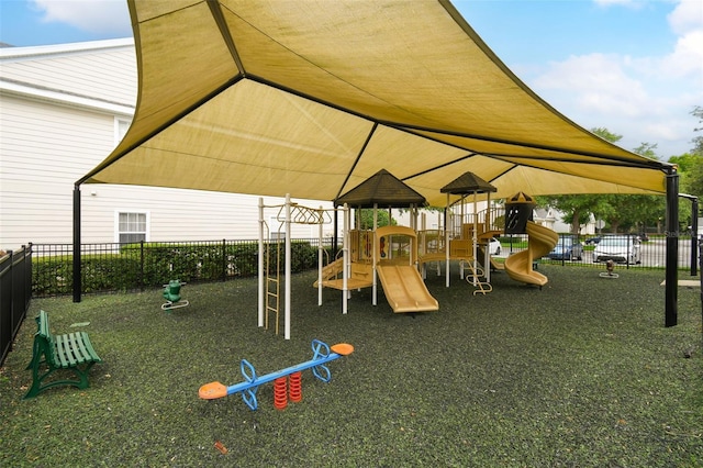 view of playground featuring fence