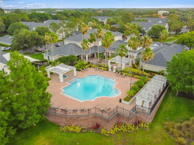 pool featuring a residential view and a patio