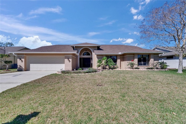 ranch-style home with a garage, driveway, a front lawn, and stucco siding