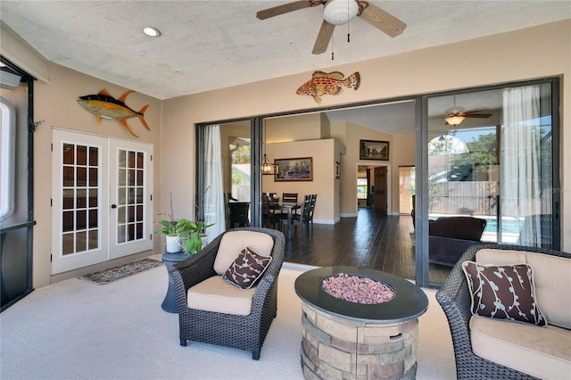 view of patio with a ceiling fan and french doors