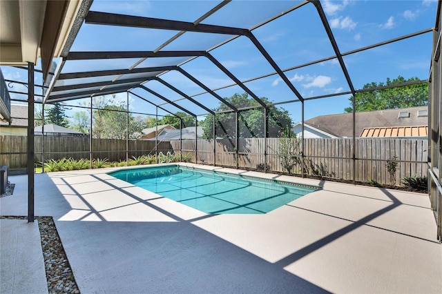 view of swimming pool featuring a patio area, a fenced backyard, glass enclosure, and a fenced in pool