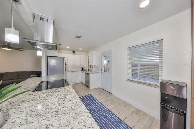 kitchen with stainless steel appliances, visible vents, wood tiled floor, white cabinets, and island range hood