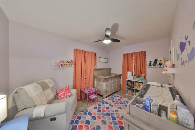 bedroom with ceiling fan and wood finished floors