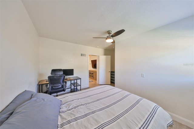 bedroom featuring baseboards, visible vents, and a ceiling fan