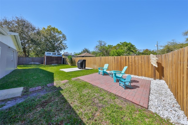 view of yard featuring a patio area and a fenced backyard