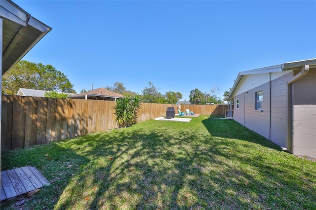 view of yard featuring a fenced backyard and a patio