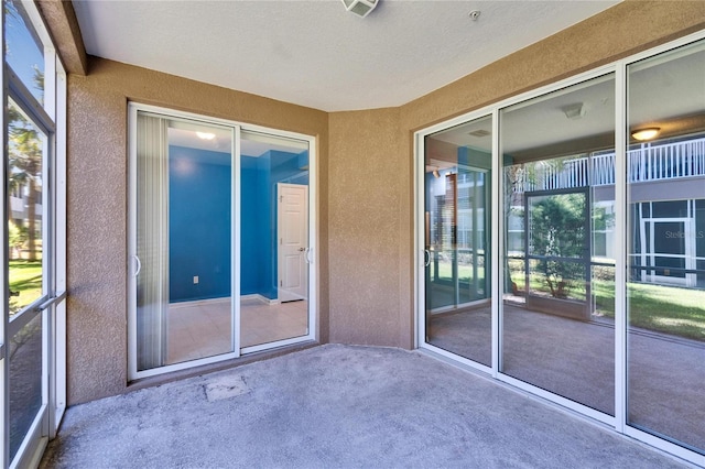 unfurnished sunroom featuring visible vents