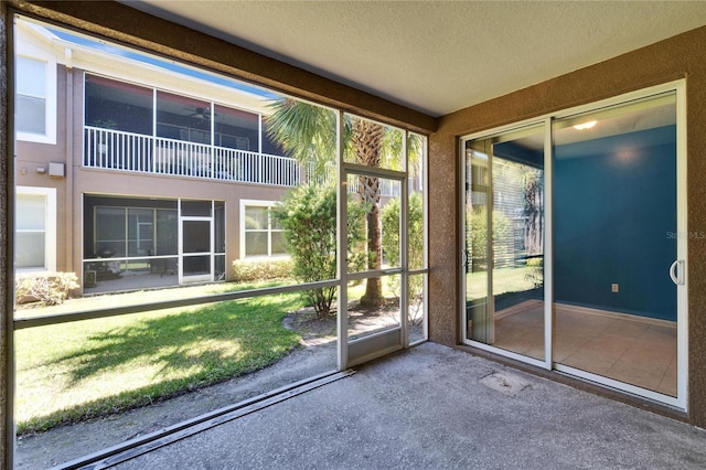 unfurnished sunroom featuring a healthy amount of sunlight