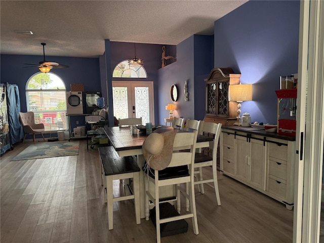 2069 Overbrook Ln, Spring Hill, FL 34606 - dining space featuring french doors, a textured ceiling, wood finished floors, and ceiling fan
