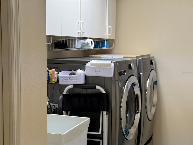 2069 Overbrook Ln, Spring Hill, FL 34606 - clothes washing area with washer and dryer and cabinet space