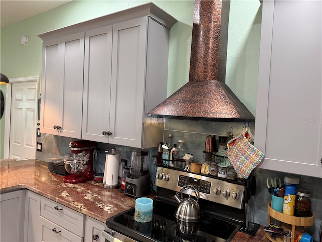 2069 Overbrook Ln, Spring Hill, FL 34606 - kitchen featuring stainless steel electric range oven, wall chimney range hood, decorative backsplash, and stone counters