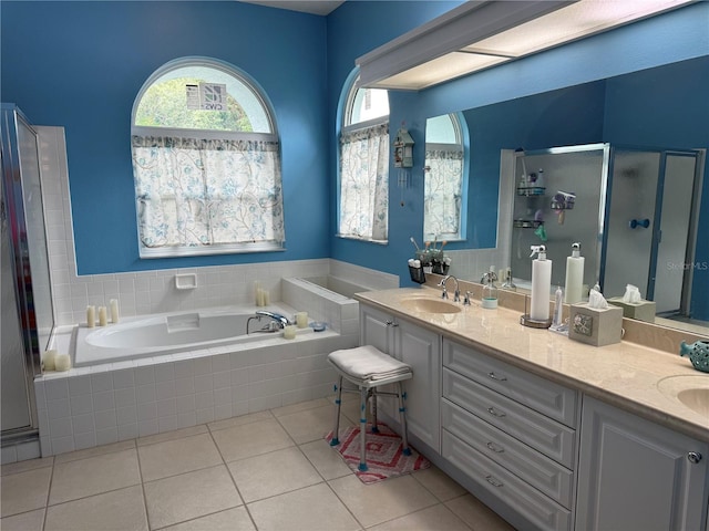 2069 Overbrook Ln, Spring Hill, FL 34606 - full bath with a bath, a stall shower, tile patterned flooring, and double vanity