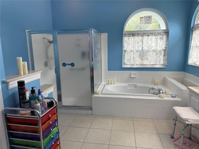 2069 Overbrook Ln, Spring Hill, FL 34606 - full bath featuring a shower stall, a garden tub, and tile patterned flooring