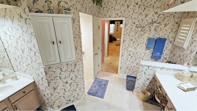 bathroom featuring wallpapered walls, vanity, and tile patterned flooring