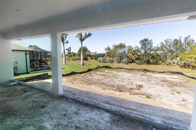 view of yard featuring a lanai