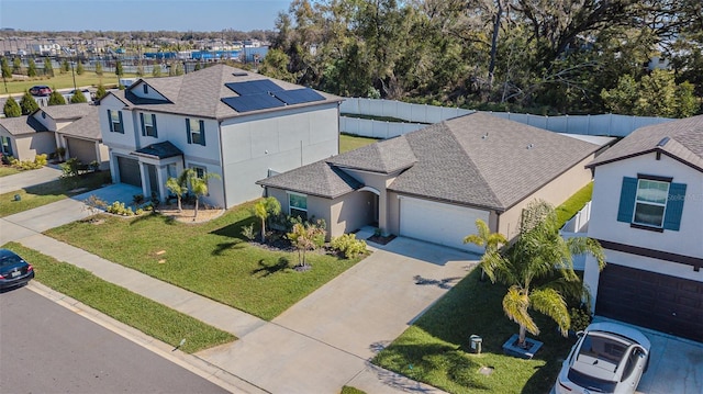 birds eye view of property with a residential view