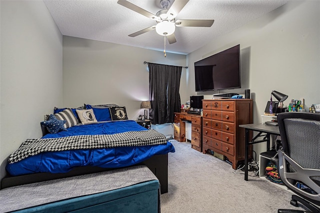 bedroom with a textured ceiling, ceiling fan, and carpet flooring