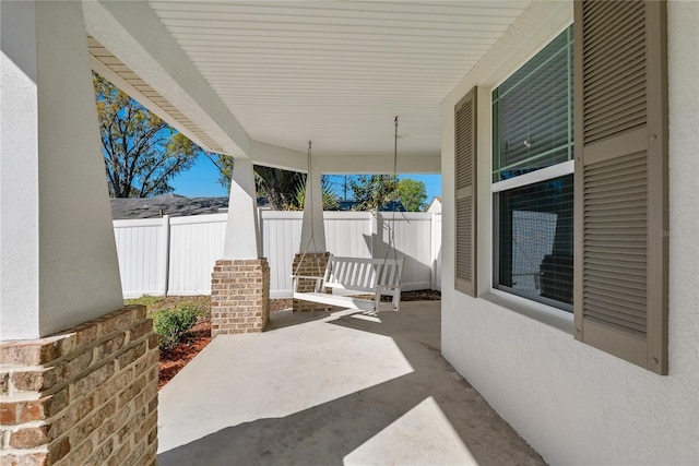 view of patio / terrace featuring fence