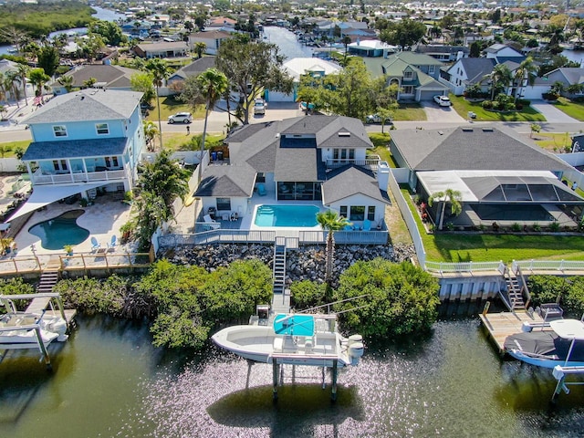 bird's eye view featuring a residential view and a water view