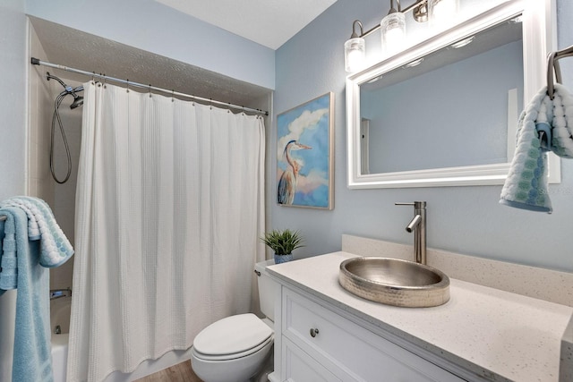 full bath featuring toilet, shower / tub combo with curtain, and vanity