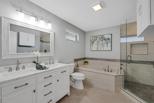 full bathroom featuring tile patterned flooring, a shower stall, a garden tub, and a sink