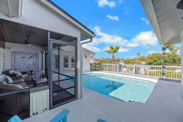 view of pool featuring a ceiling fan and a fenced in pool