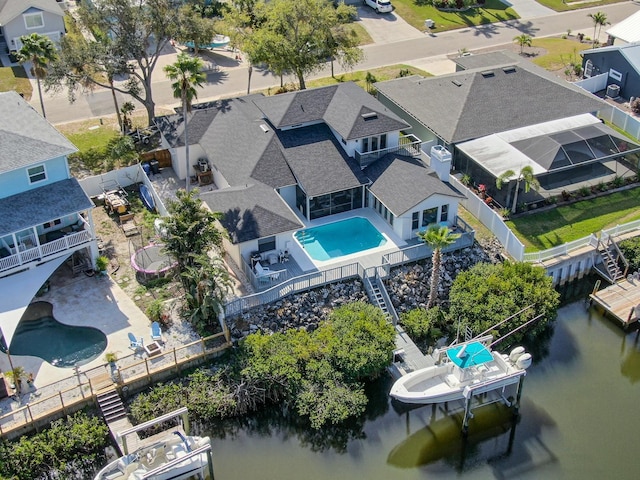 aerial view with a water view and a residential view