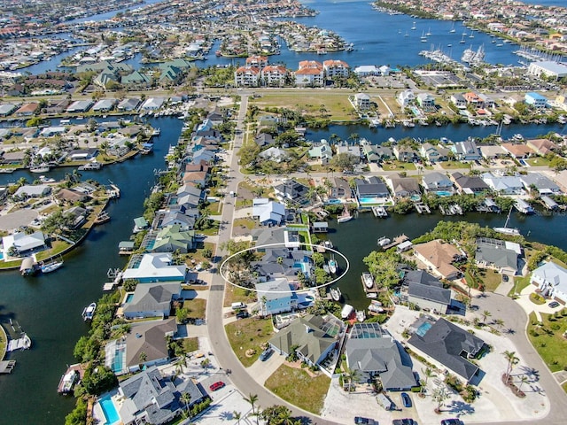 bird's eye view featuring a residential view and a water view