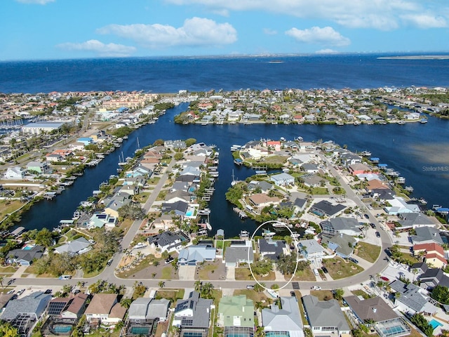 drone / aerial view featuring a water view and a residential view