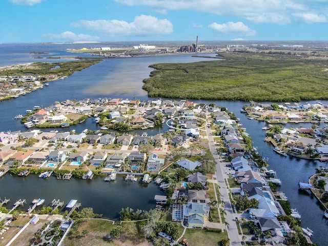 birds eye view of property with a water view and a residential view