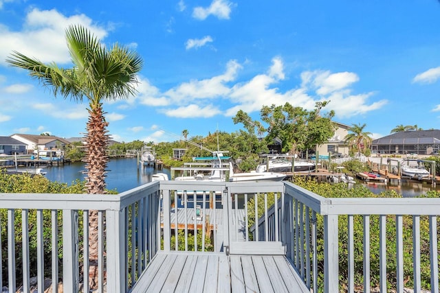 6606 Dolphin Cove Dr, Apollo Beach, FL 33572 - wooden terrace featuring a water view, a dock, and boat lift