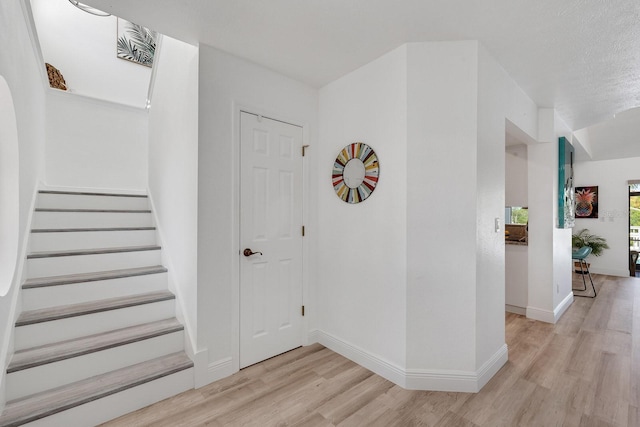 6606 Dolphin Cove Dr, Apollo Beach, FL 33572 - foyer entrance featuring light wood-type flooring, stairs, and baseboards