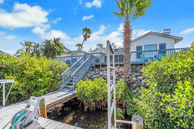 6606 Dolphin Cove Dr, Apollo Beach, FL 33572 - back of house with stairway and a deck