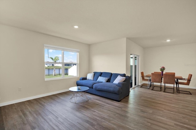 living area featuring recessed lighting, wood finished floors, and baseboards