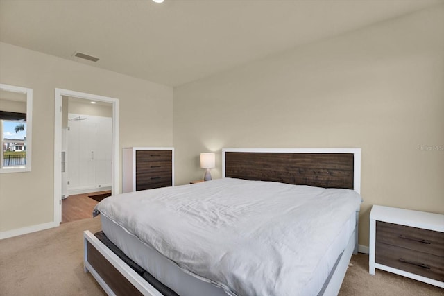 bedroom with visible vents, baseboards, and carpet flooring