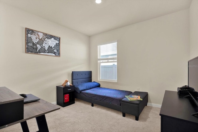 bedroom with carpet and baseboards