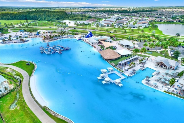 bird's eye view featuring a residential view and a water view