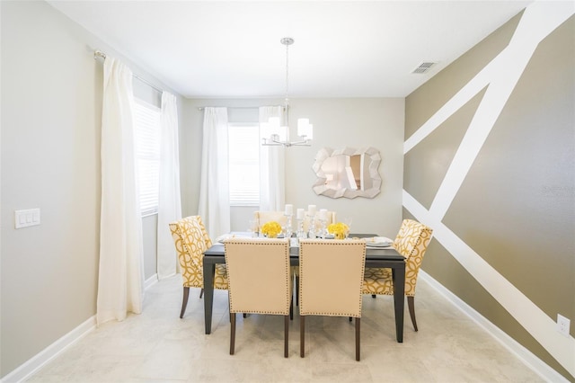 dining room with an inviting chandelier, baseboards, and visible vents