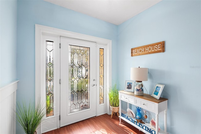 entryway with wood finished floors