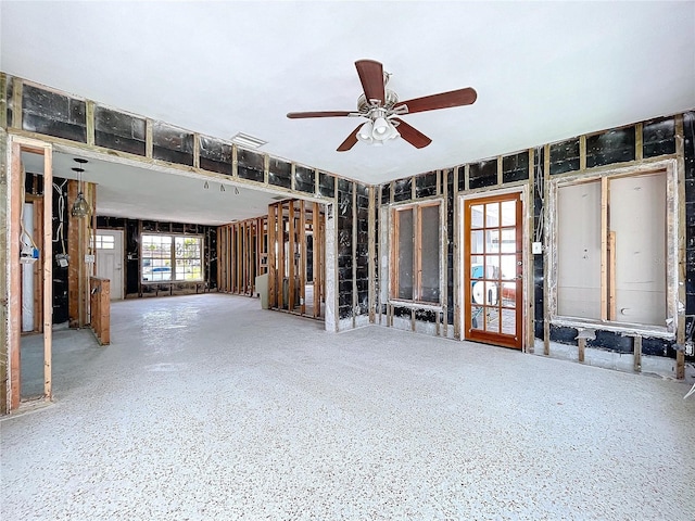 interior space featuring ceiling fan and visible vents