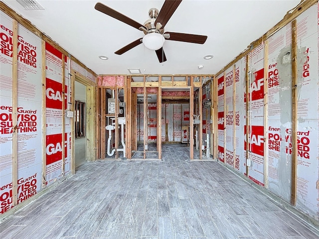 miscellaneous room featuring wood finished floors, visible vents, and a ceiling fan