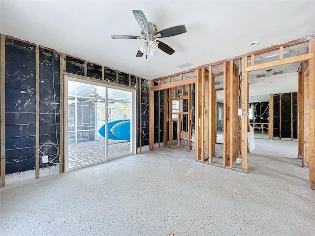 interior space featuring a ceiling fan and visible vents